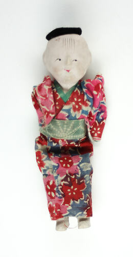 Small Japanese doll in kimono, front side.