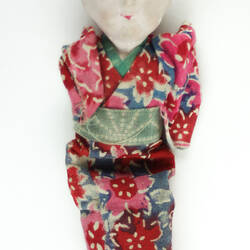 Small Japanese doll in kimono, front side.