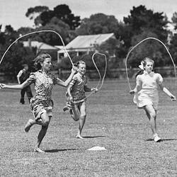 SUNSHINE REVIEW, MARCH 1949: AT THE PICNIC - THE GIRLS MAKE A CHARMING ACTION PICTURE AS THEY RACE FOR THE SKIPPING PRIZE.