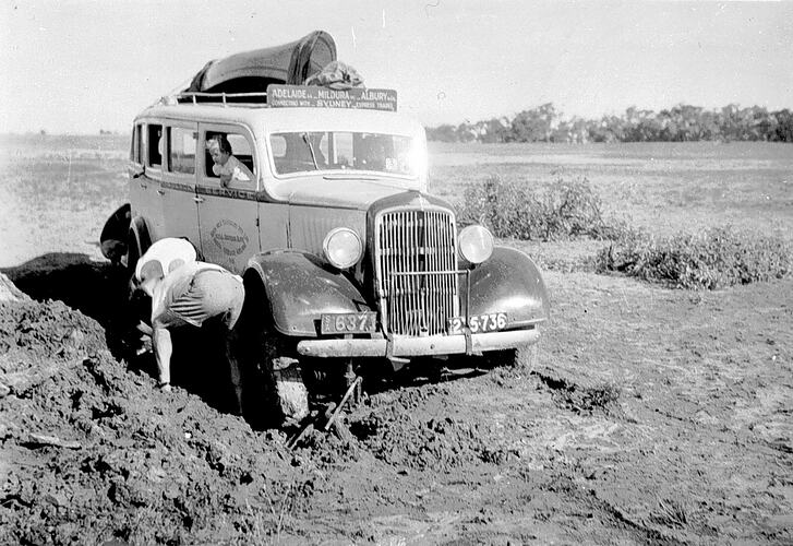[A bus bogged in the Mallee, near Mildura, about 1935. The bus was travelling from Adelaide to Albury via Mildura.]
