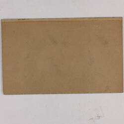 Retangular brown card.