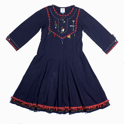 Navy blue long sleeved dress with red trim.