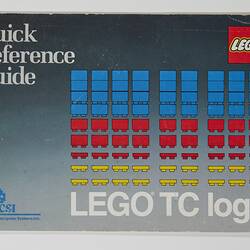 Front cover with rows of separate Lego pieces in blue, red and yellow. Text above and below.