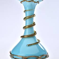 Pale blue opaque glass vase with gilded ribbon spiralling from base up to top. Flared neck with frill at top.