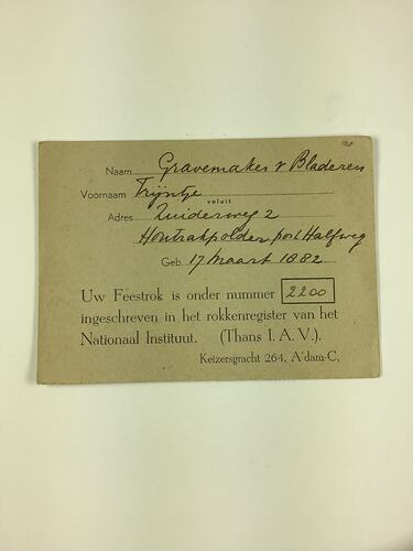 Grey card with black printing and handwriting.