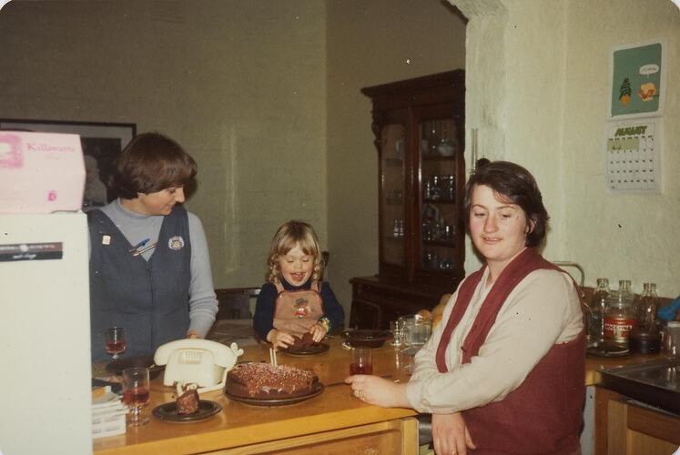 Digital Photograph - Family & Friends Celebrating Girl's Second Birthday in Kitchen, Fitzroy, 1979