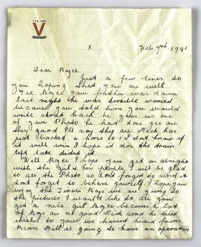 Handwritten letter on lined paper with red V logo at top. Handwriting is in cursive script, black ink.