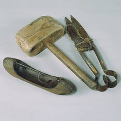 Tools used for mat making including; hand shears, wooden mallet and mat making shuttle.