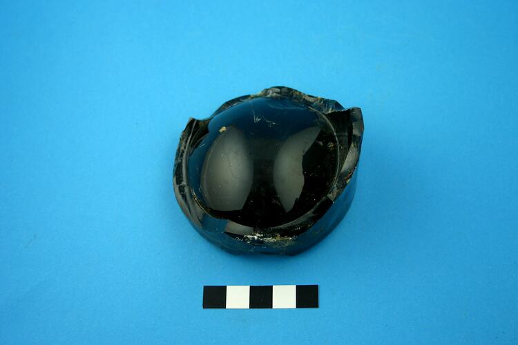 Dark green glass bottle base.