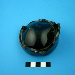 Dark green glass bottle base.