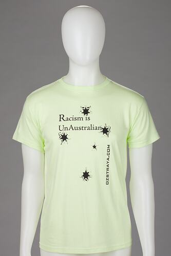 Yellow t-shirt with "Racism Is UnAustralian" logo.