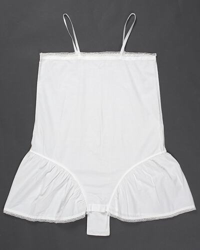 White, lace-trimmed, thin-strapped lingerie with central fastener flap.