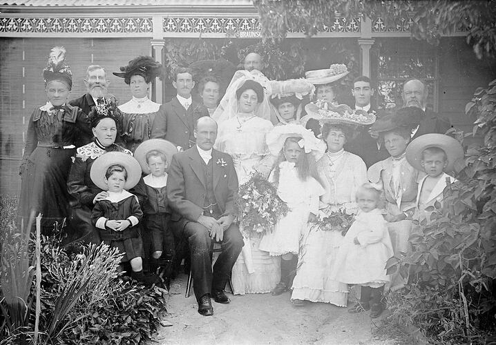 Wedding group in front of a family house.