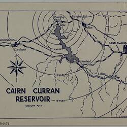 Rectangular buff-coloured card with blue printed text and map.