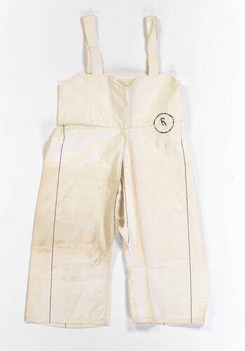 Cream calico overall-style bodice attached at the waist to crutchless divided legs.