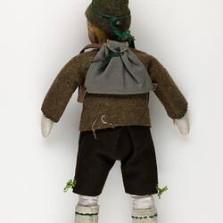 Reverse view of male doll.