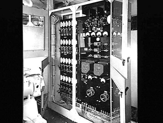Ship interior. Engine room with fluorescent switchboard.