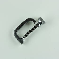 Metal screw clamp.