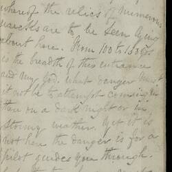 Open diary with handwritten text on discoloured worn page.