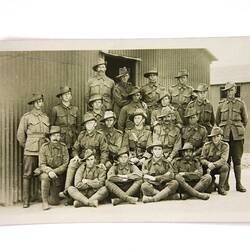 Front of postcard with group of soldiers.