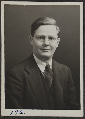 Studio portrait of man in suit.