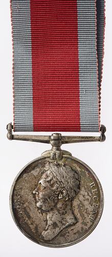 Silver medal with laureate head of the Prince Regent facing left. Medal suspended from ribbon.