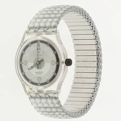 Silver wristwatch with quartered manual clock face and gridded band.