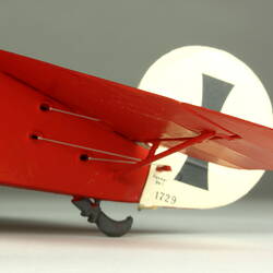 Red aeroplane model. Detail of tail.