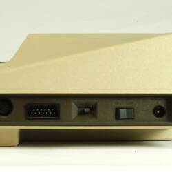 Side view of beige plastic unit with keyboard.