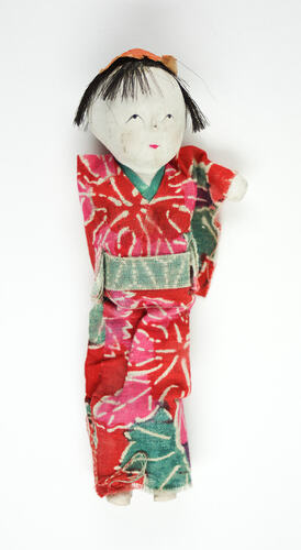 Small Japanese doll in kimono, front side.