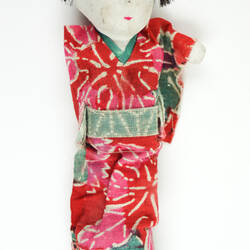 Small Japanese doll in kimono, front side.
