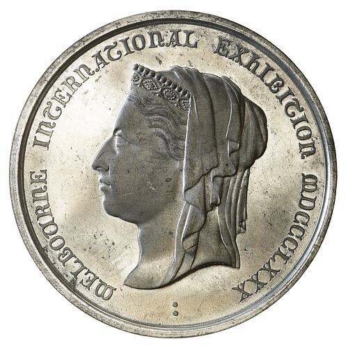 Round silver medal features a head of Queen Victoria facing left wearing a coronet and veil.