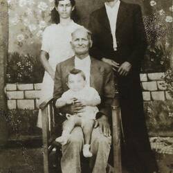 Digital Photograph - Efstathia Spiropoulos With Family & Son, Flessiada, Greece, 1947