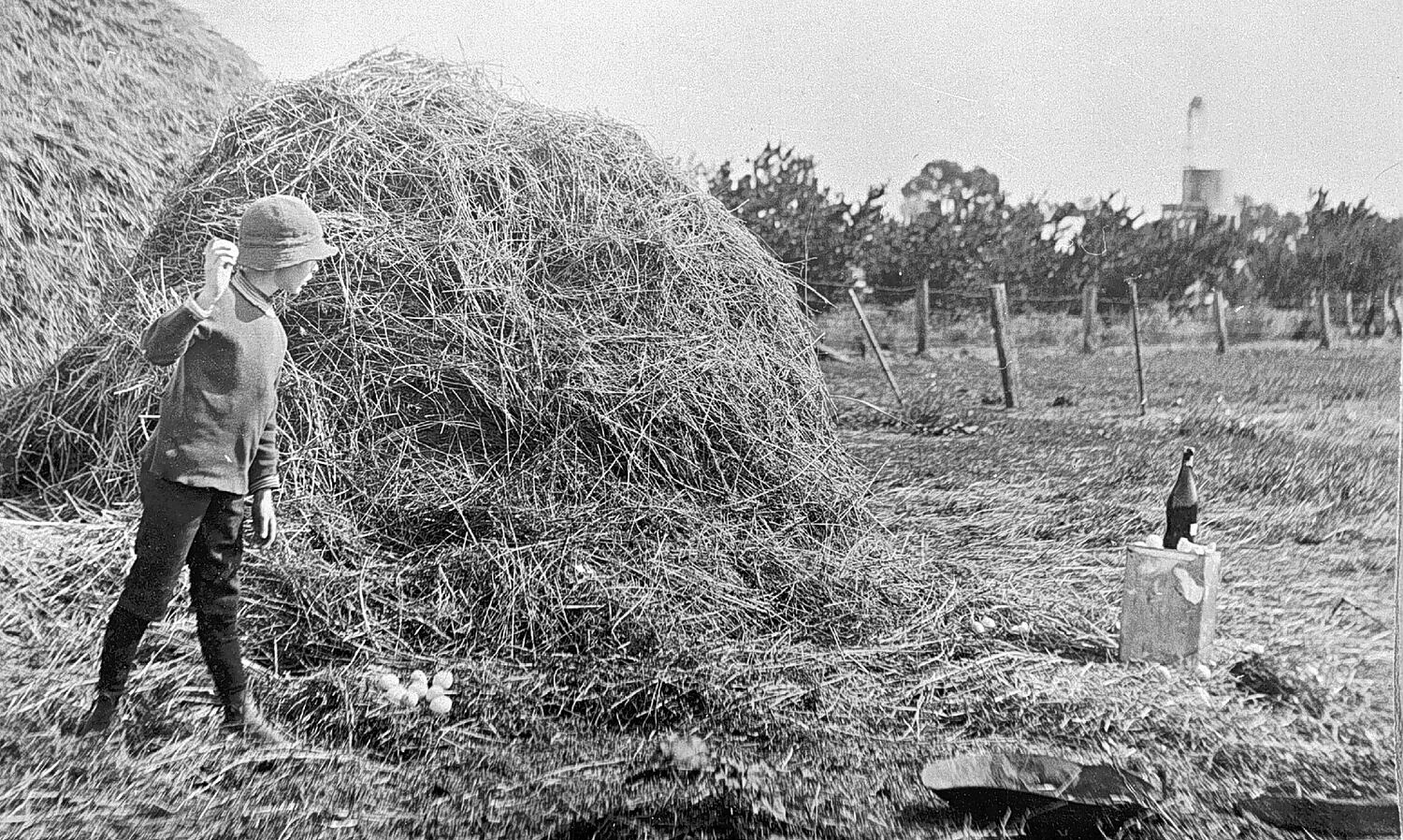 Negative Boy Throwing Eggs at a Bottle Behind Haystack, Merrigum