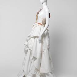 White ruffled wedding dress. Strapless on left side.