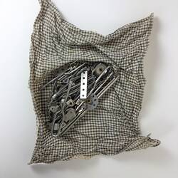 Check cloth containing construction pieces.