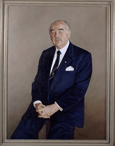 Painted portrait of seated man wearing a blue suit and tie. Olive green background. Gold-coloured frame.