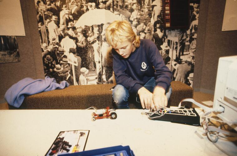 A student making a programmable Lego vehicle.