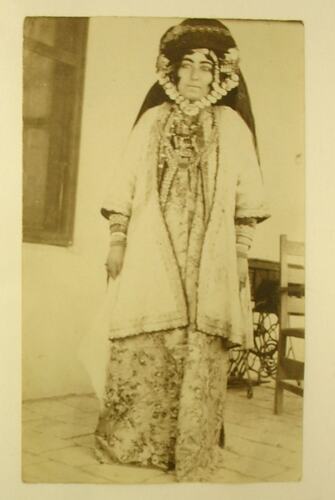 Kurdish woman wearing traditional clothing.