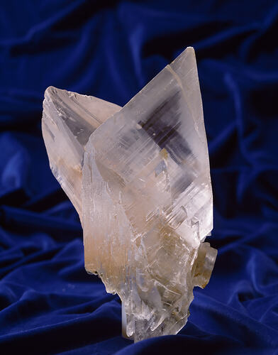 Translucent white pointy mineral specimen.