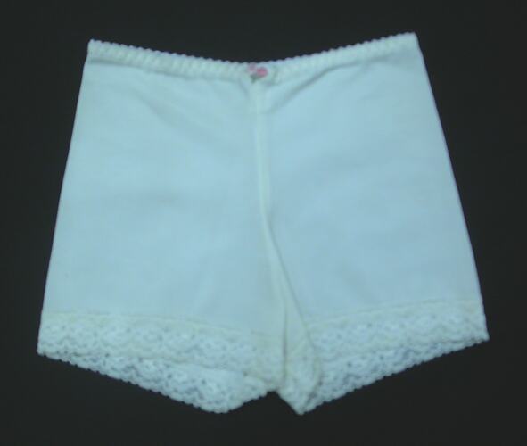 Front view of cream panty girdle on flat surface.