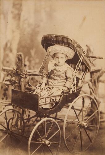 Digital Photograph - Baby in Elaborate Perambulator, 1887