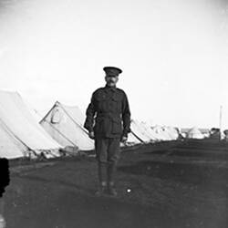 Digital Photograph - Soldier Outside Tents at Royal Park Army Camp, Parkville, 1915