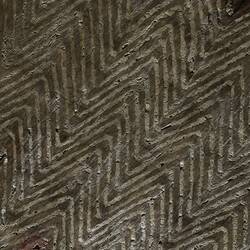 Detail of incised pattern on wooden shield.