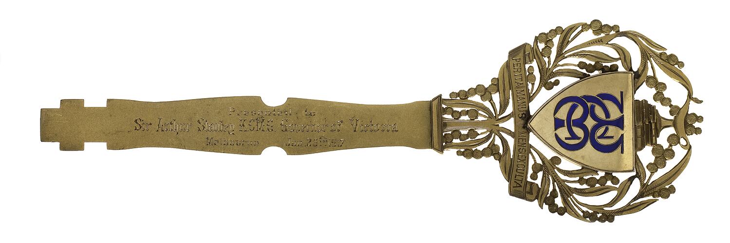 Ornate metal presentation key. Enamelled 15ct gold, engraved on both sides with Australian animals and foliage