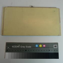 Painted board showing sample of ivory colour.