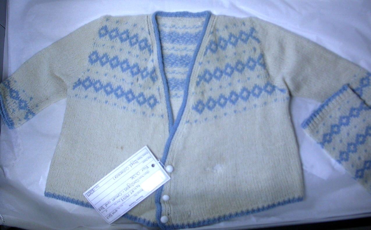 Museums Victoria HT 19078, Cream-and-blue cardigan