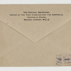 The back of an envelope showing typed sender's address.
