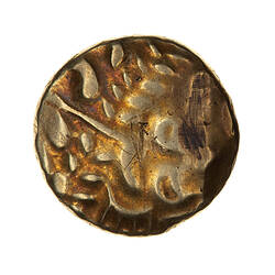 Coin, round, disintegrated horse composed of dots, lines & crescents to the right.