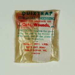 Surgical dressing sealed in square plastic bag